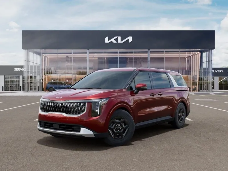 2026 Kia Carnival LXS in Flare Red — front three-quarter view