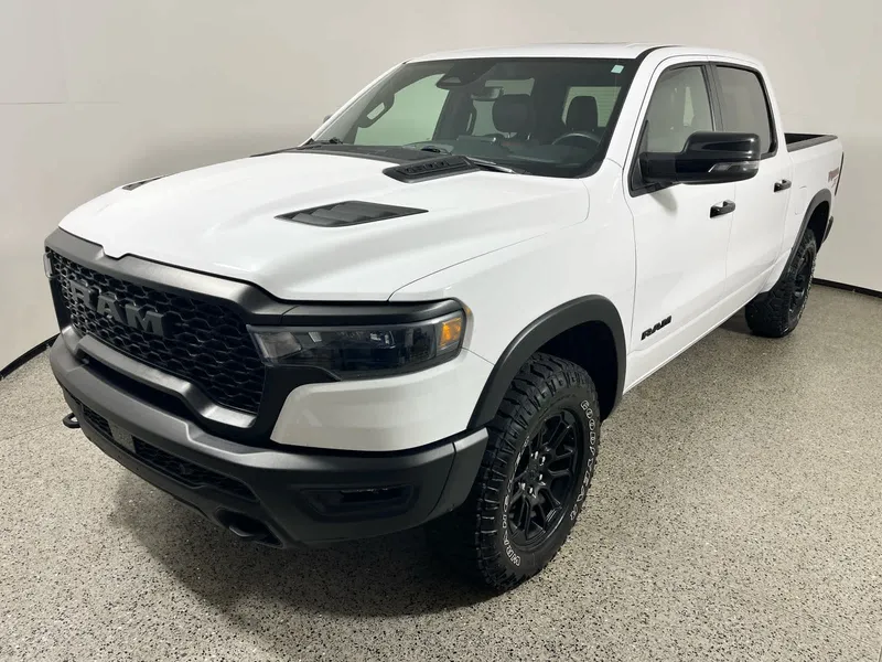 2025 RAM 1500 Rebel in Bright White Clearcoat — front three-quarter view