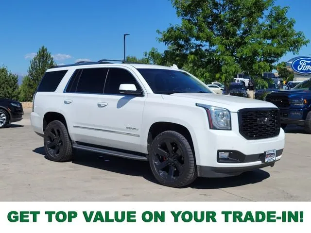 2019 GMC Yukon Denali in Summit White — front three-quarter view