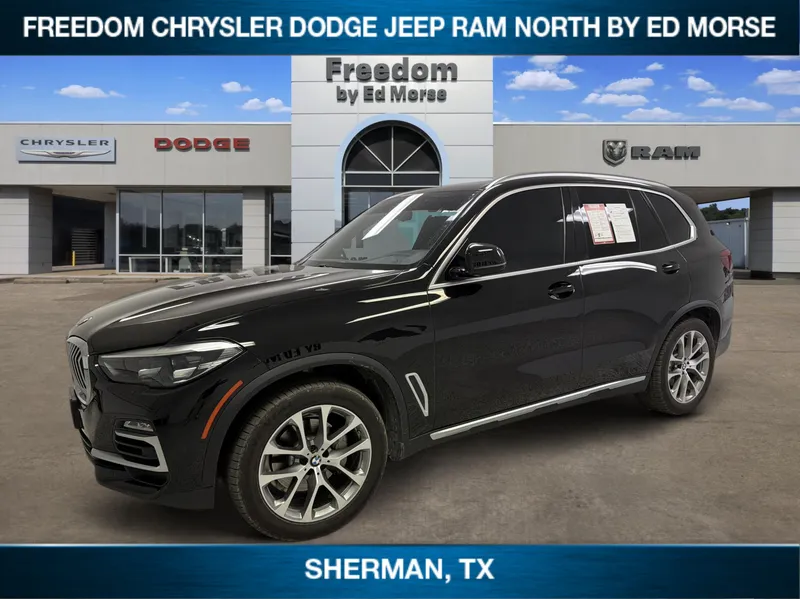 2019 BMW X5 xDrive40i in Jet Black — front three-quarter view