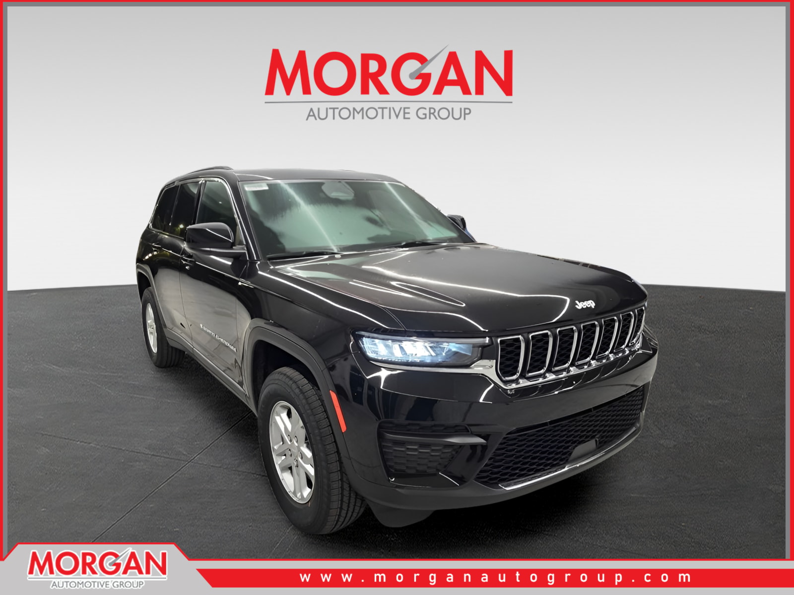 2025 Jeep Grand Cherokee Laredo in Diamond Black Crystal Pearlcoat — front three-quarter view