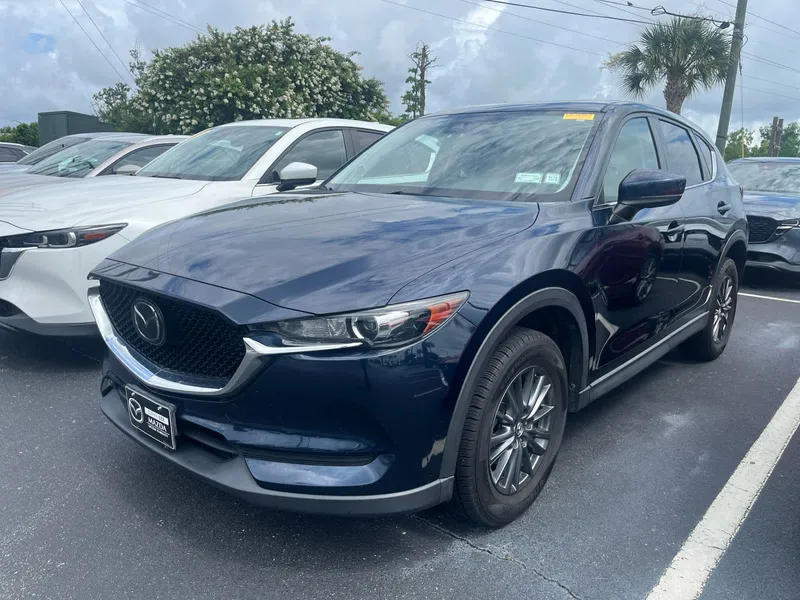 2019 Mazda Mazda CX-5 Touring in Deep Crystal Blue Mica — front three-quarter view