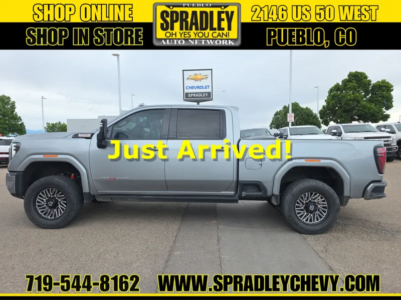 2024 GMC Sierra 2500 HD AT4 in Sterling Metallic — front three-quarter view