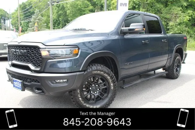 2025 RAM 1500 Rebel in Forged Blue Metallic — front three-quarter view
