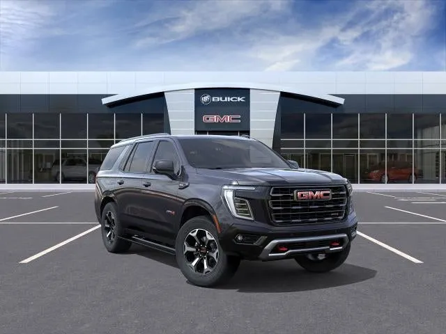 2026 GMC Yukon AT4 Ultimate in Titanium Rush Metallic — front three-quarter view