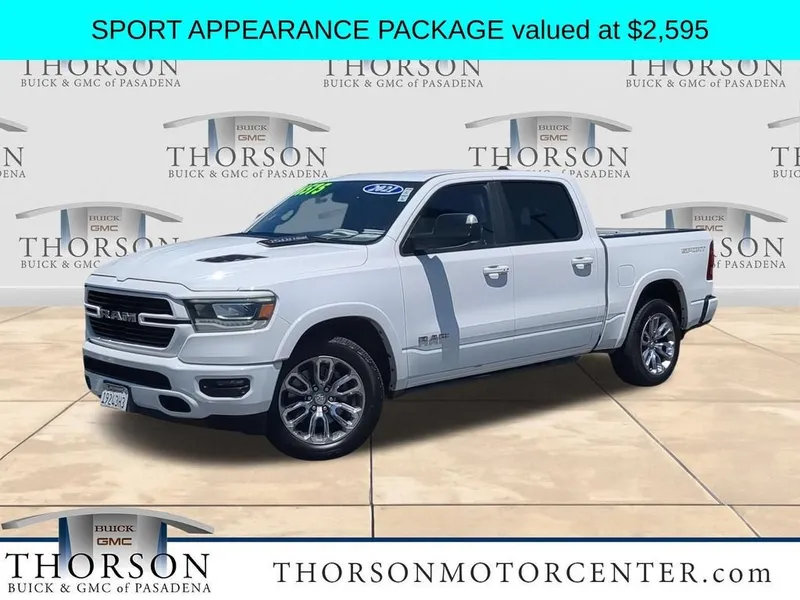 2021 RAM 1500 Laramie in Bright White Clea — front three-quarter view