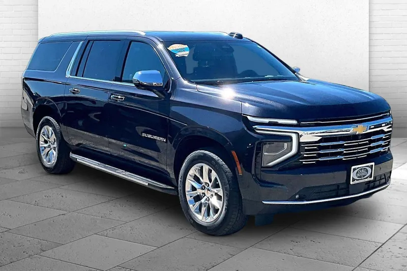 2025 Chevrolet Suburban Premier in Dark Ash Metallic — front three-quarter view