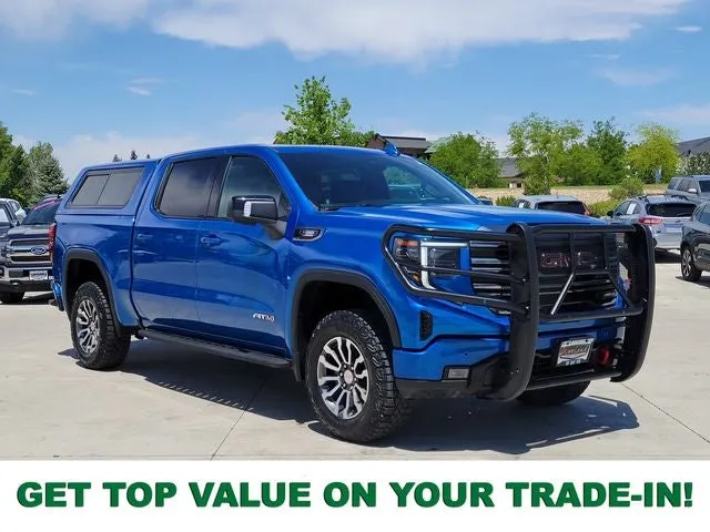 2023 GMC Sierra 1500 AT4 in Dynamic Blue Metallic — front three-quarter view