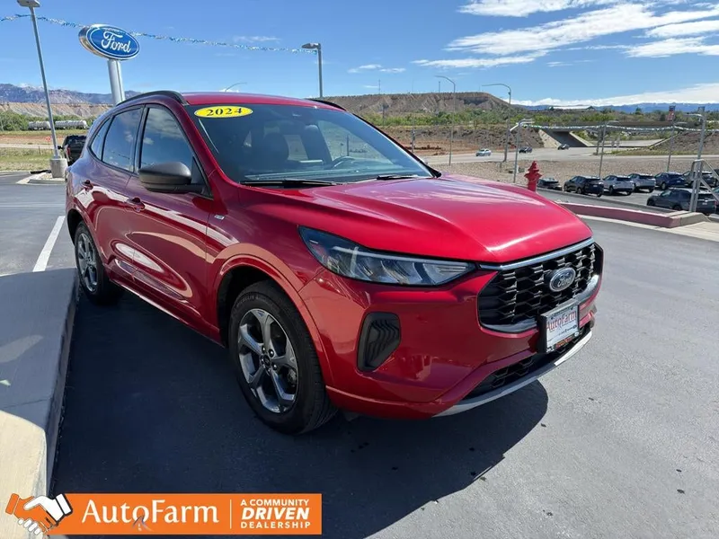 2024 Ford Escape ST-Line in Rapid Red Metallic Tinted Clearcoat — front three-quarter view