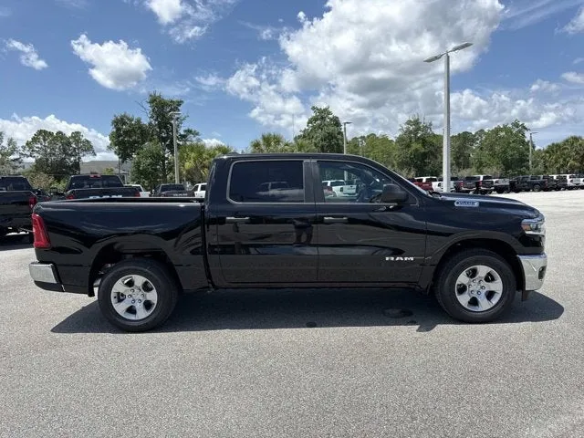 2026 RAM 1500 Big Horn in Diamond Black Crystal Pearlcoat — front three-quarter view