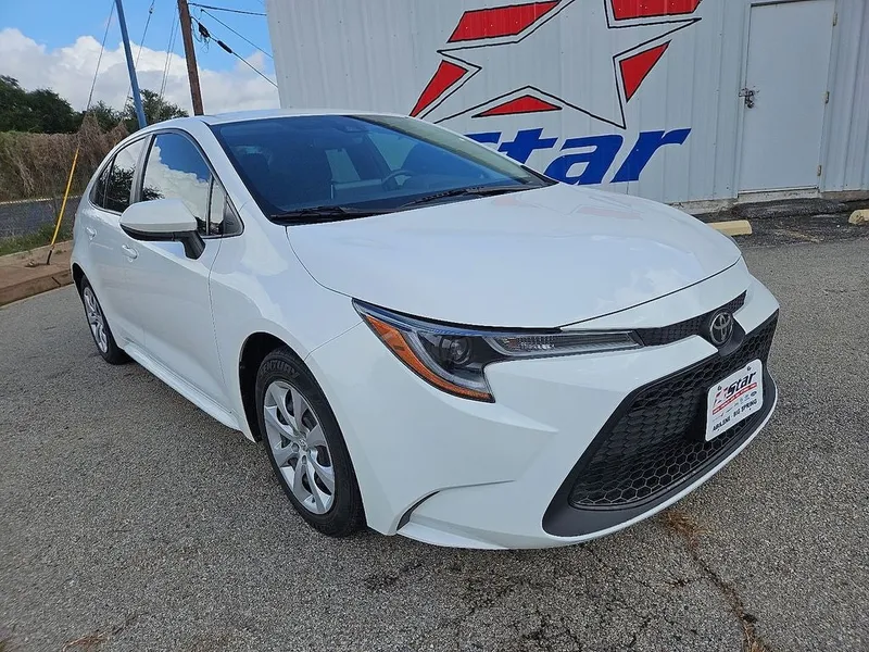 2021 Toyota Corolla LE in Super White — front three-quarter view
