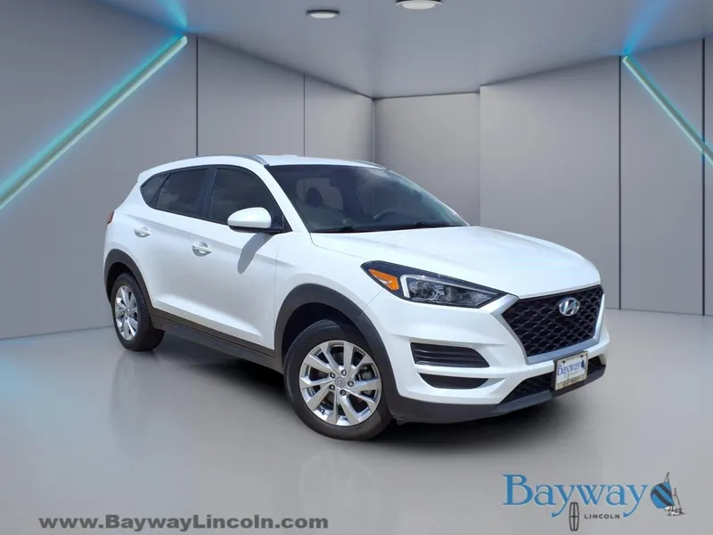 2021 Hyundai Tucson Value in White Cream — front three-quarter view