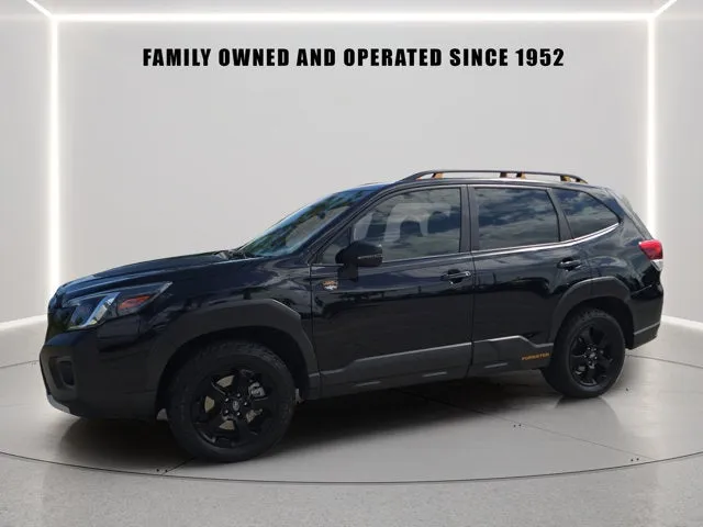 2024 Subaru Forester Wilderness in Crystal Black Silica — front three-quarter view