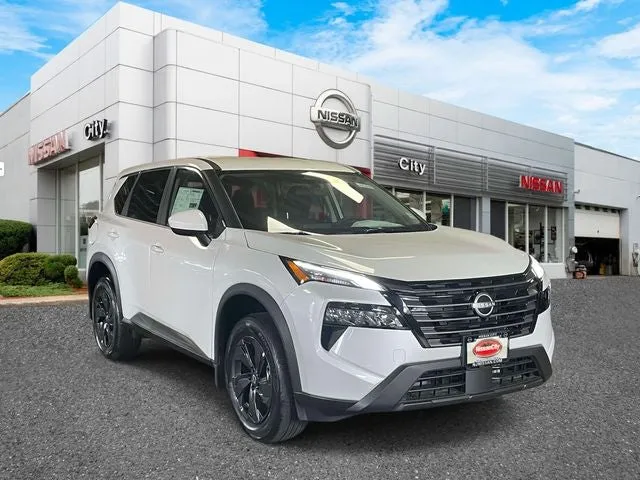 2026 Nissan Rogue SV in Everest White Pearl Tricoat — front three-quarter view