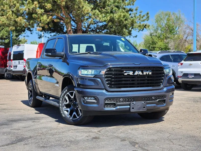 2026 RAM 1500 Laramie Crew Cab 4x4 5'7' Box in Forged Blue Metallic — front three-quarter view
