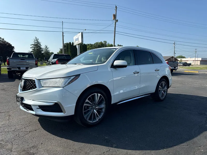2017 Acura MDX w/Technology Package in White — front three-quarter view