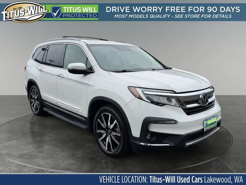 2021 Honda Pilot Elite in White — front three-quarter view