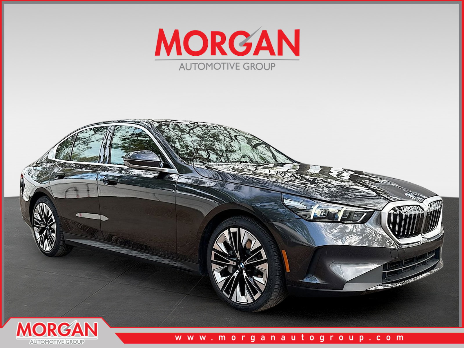 2026 BMW 5 Series 530i in Dark Graphite Metallic — front three-quarter view