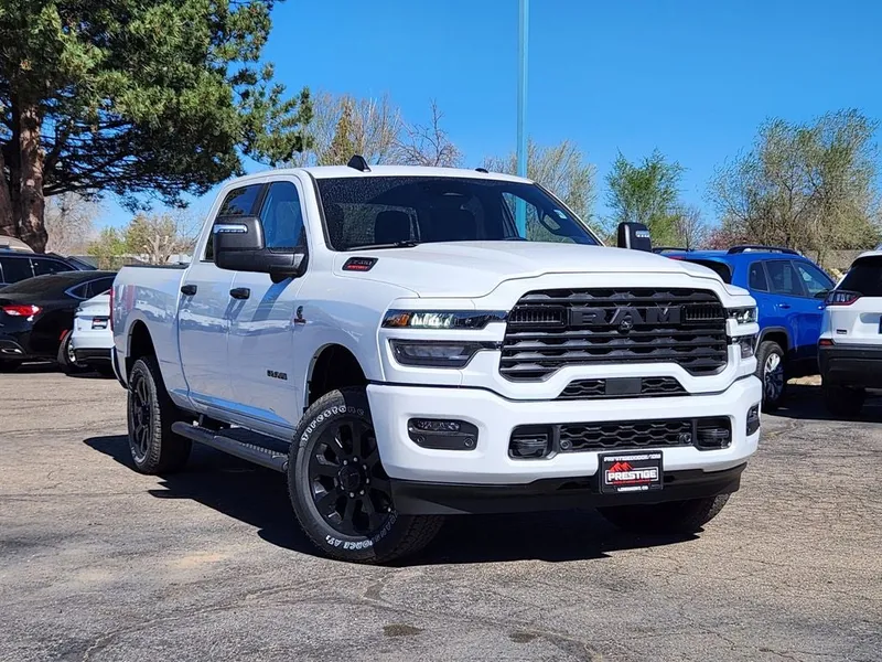 2026 RAM 3500 RAM 3500 BIG HORN CREW CAB 4X4 6'4' BOX in Bright White Clear-Coat Exterior Paint — front three-quarter view