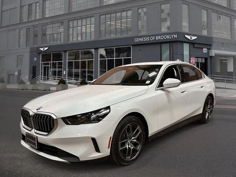 2026 BMW 5 Series 530i xDrive in Alpine White — front three-quarter view