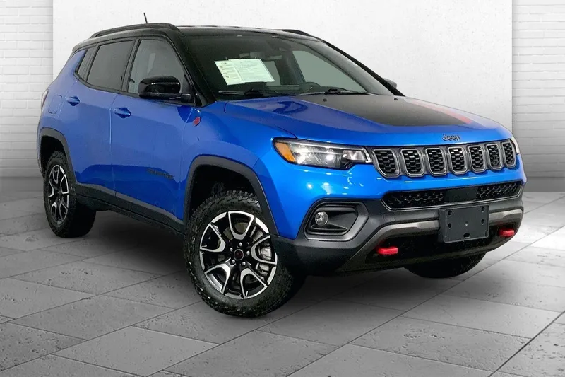 2025 Jeep Compass Trailhawk in Hydro Blue Pearlc — front three-quarter view
