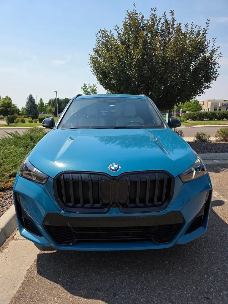 2025 BMW X1 xDrive28i in Blue Bay Lagoon Metallic — front three-quarter view