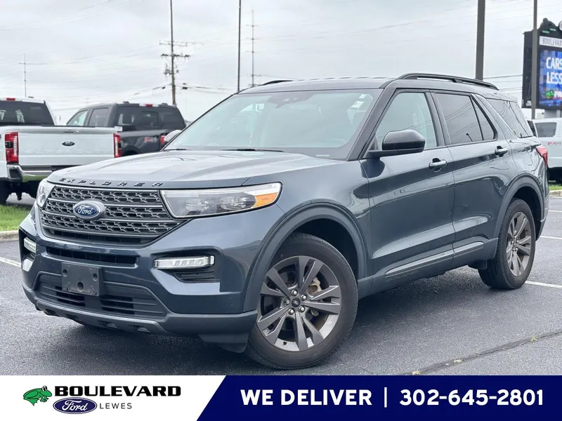 2023 Ford Explorer XLT in Stone Blue — front three-quarter view