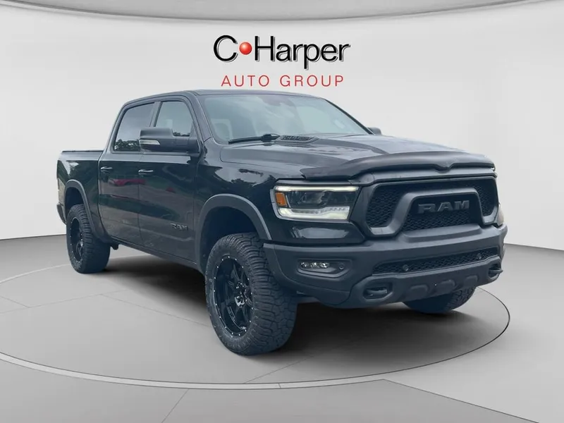 2021 RAM 1500 Rebel Crew Cab 4x4 5'7" Box in Black — front three-quarter view