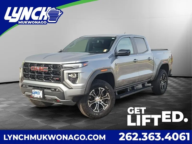 2024 GMC Canyon AT4 in Sterling Metallic — front three-quarter view