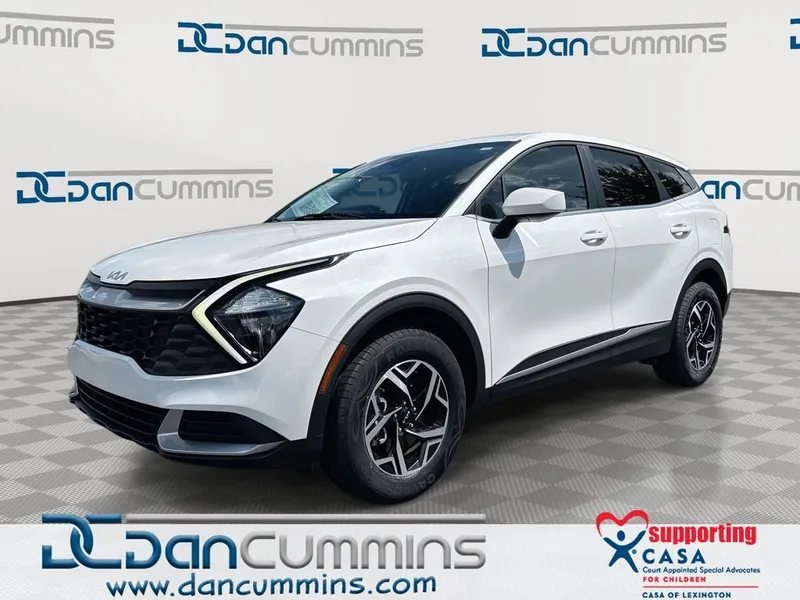 2023 Kia Sportage LX in Snow White Pearl — front three-quarter view
