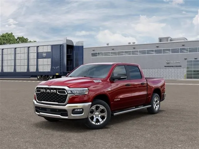 2026 RAM Ram 1500 RAM 1500 BIG HORN CREW CAB 4X4 5'7' BOX in Molten Red Pearl-Coat Exterior Paint — front three-quarter view