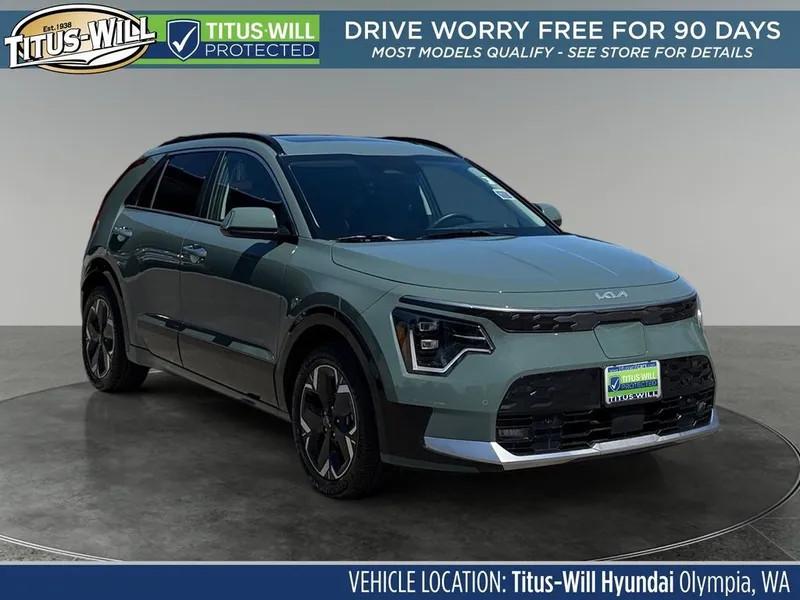 2023 Kia Niro EV Wave in Cityscape Green — front three-quarter view
