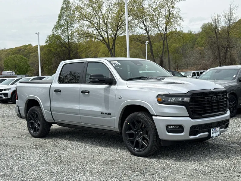2026 RAM 1500 Laramie in Silver Zynith — front three-quarter view