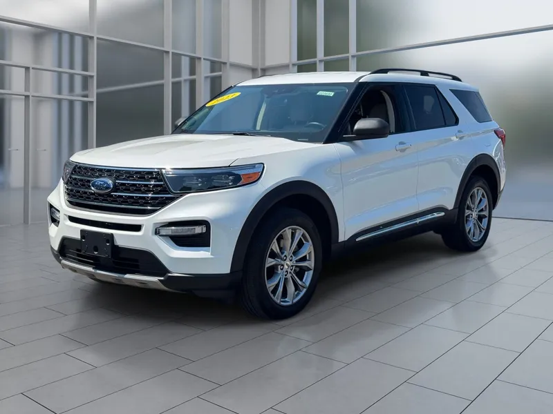 2023 Ford Explorer XLT in White Metallic — front three-quarter view