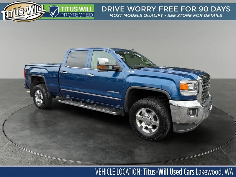 2016 GMC Sierra 2500HD SLT in Blue Metallic — front three-quarter view
