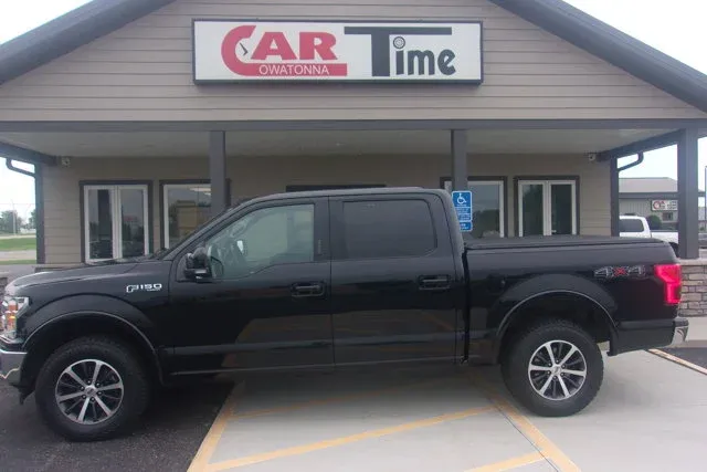 2018 Ford F-150 LARIAT in Shadow Black — front three-quarter view