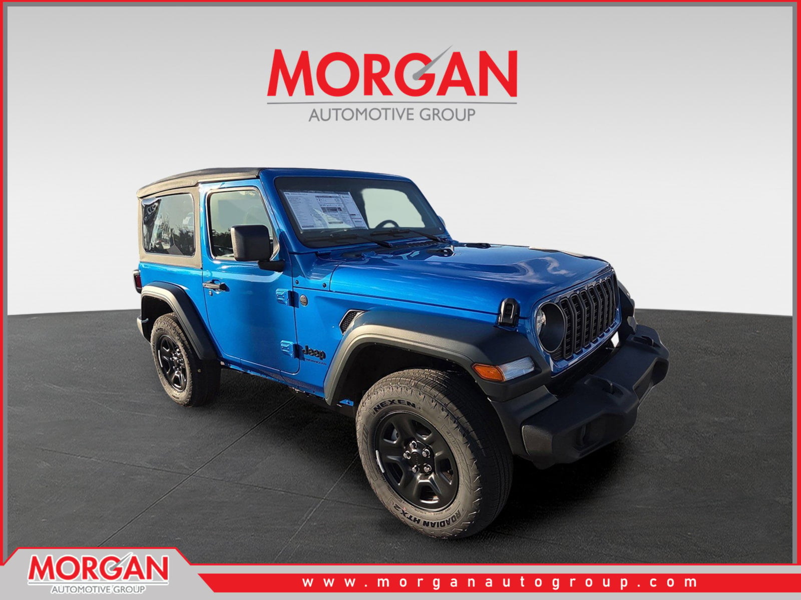 2026 Jeep Wrangler Sport in Blue — front three-quarter view
