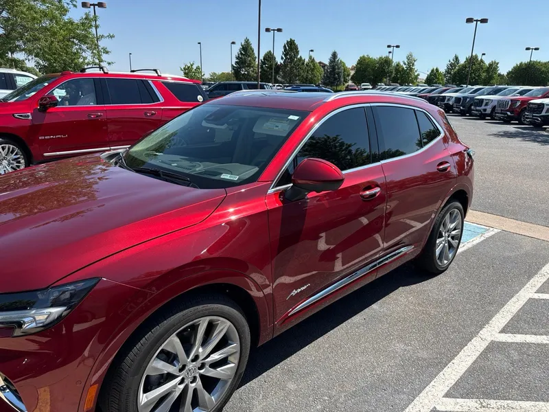 2023 Buick Envision Avenir in Cinnabar Metallic — front three-quarter view
