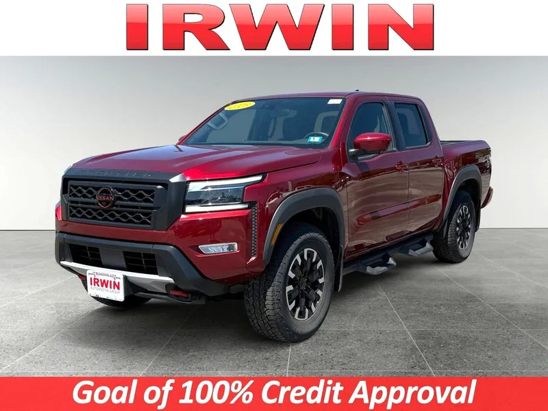 2023 Nissan Frontier PRO-4X in Cardinal Red Metallic Tricoat — front three-quarter view