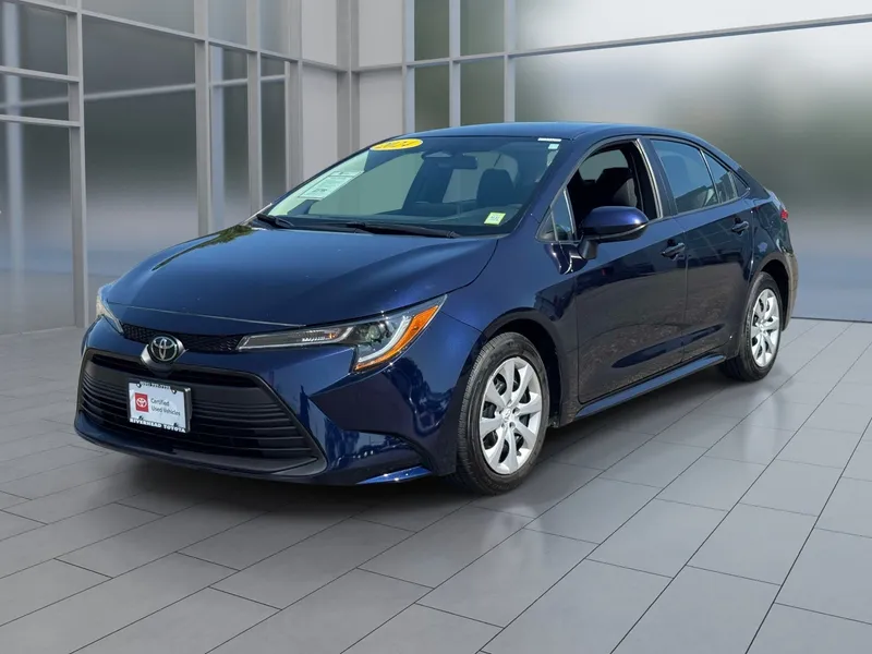 2024 Toyota Corolla LE in Blueprint — front three-quarter view