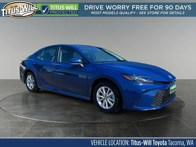 2025 Toyota Camry LE in Reservoir Blue — front three-quarter view
