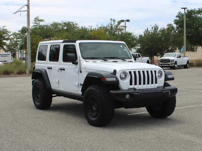 2022 Jeep Wrangler Unlimited High Tide in Bright White Clearcoat — front three-quarter view