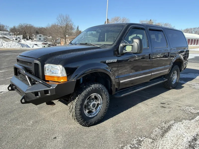 2002 Ford Excursion LIMITED 4X4 in Black — front three-quarter view