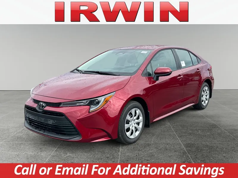 2026 Toyota Corolla LE in Ruby Flare Pearl — front three-quarter view