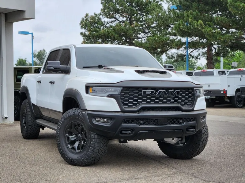 2025 RAM 1500 RHO Crew Cab 4x4 5'7' Box in Bright White Clearcoat — front three-quarter view