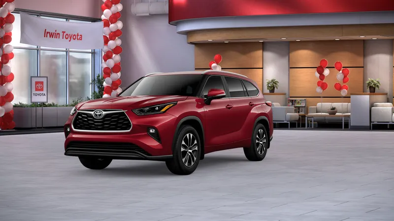 2026 Toyota Highlander XLE in Ruby Flare Pearl — front three-quarter view
