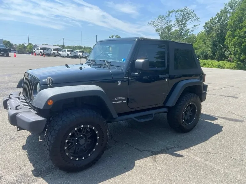 2017 Jeep Wrangler Sport in Black — front three-quarter view