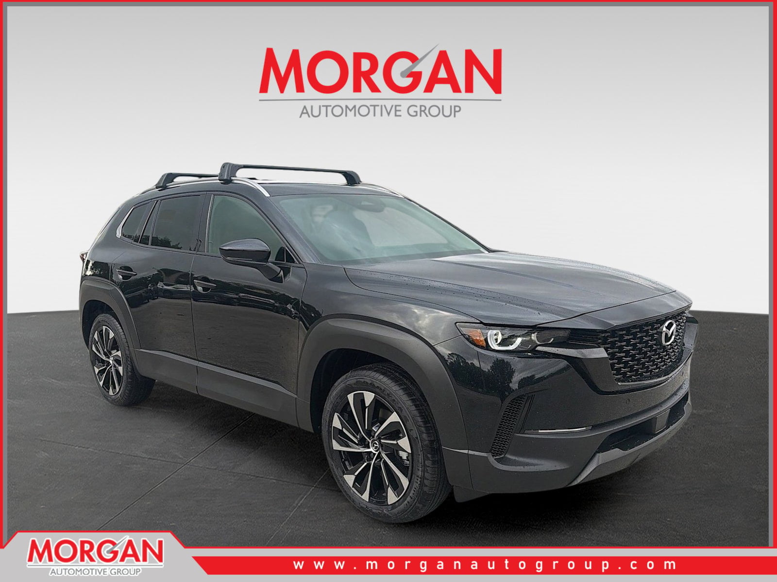2026 Mazda CX-50 Hybrid Premium Plus in Jet Black Mica — front three-quarter view