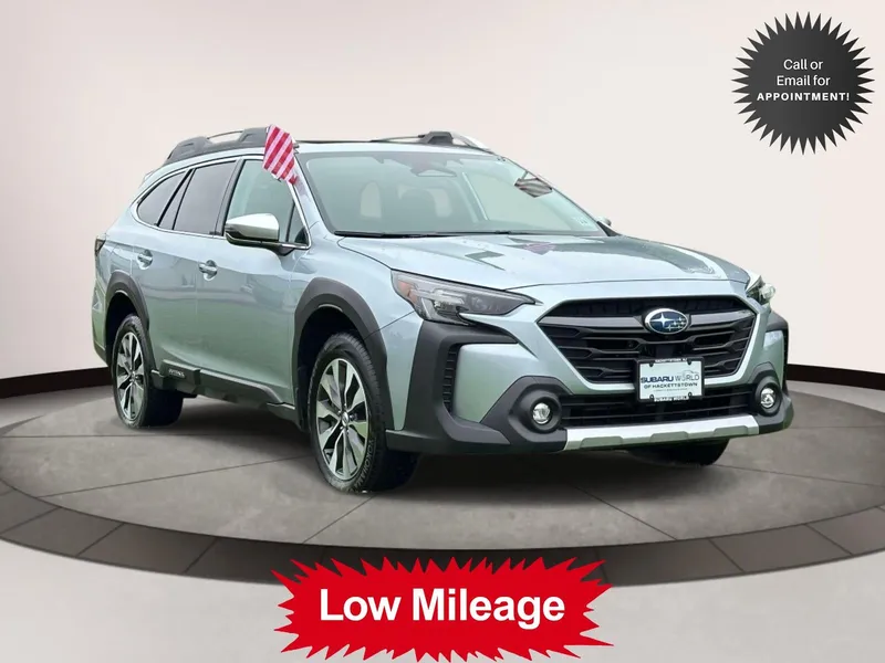 2025 Subaru Outback Touring AWD in Silver — front three-quarter view