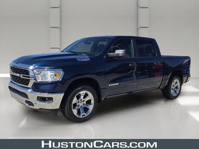 2024 RAM 1500 Big Horn 4x4 Crew Cab 5'7" Box in Patriot Blue Pearlcoat — front three-quarter view